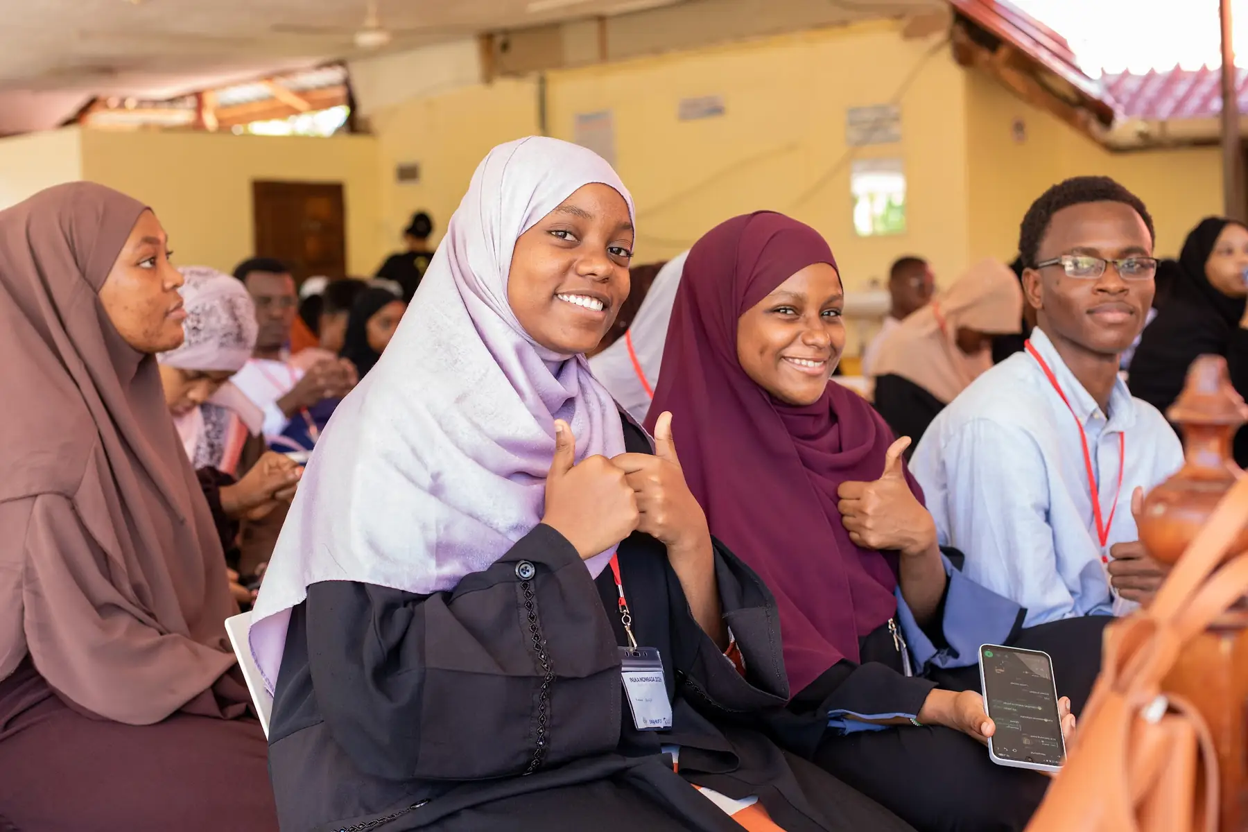 Participants smiling in the audience