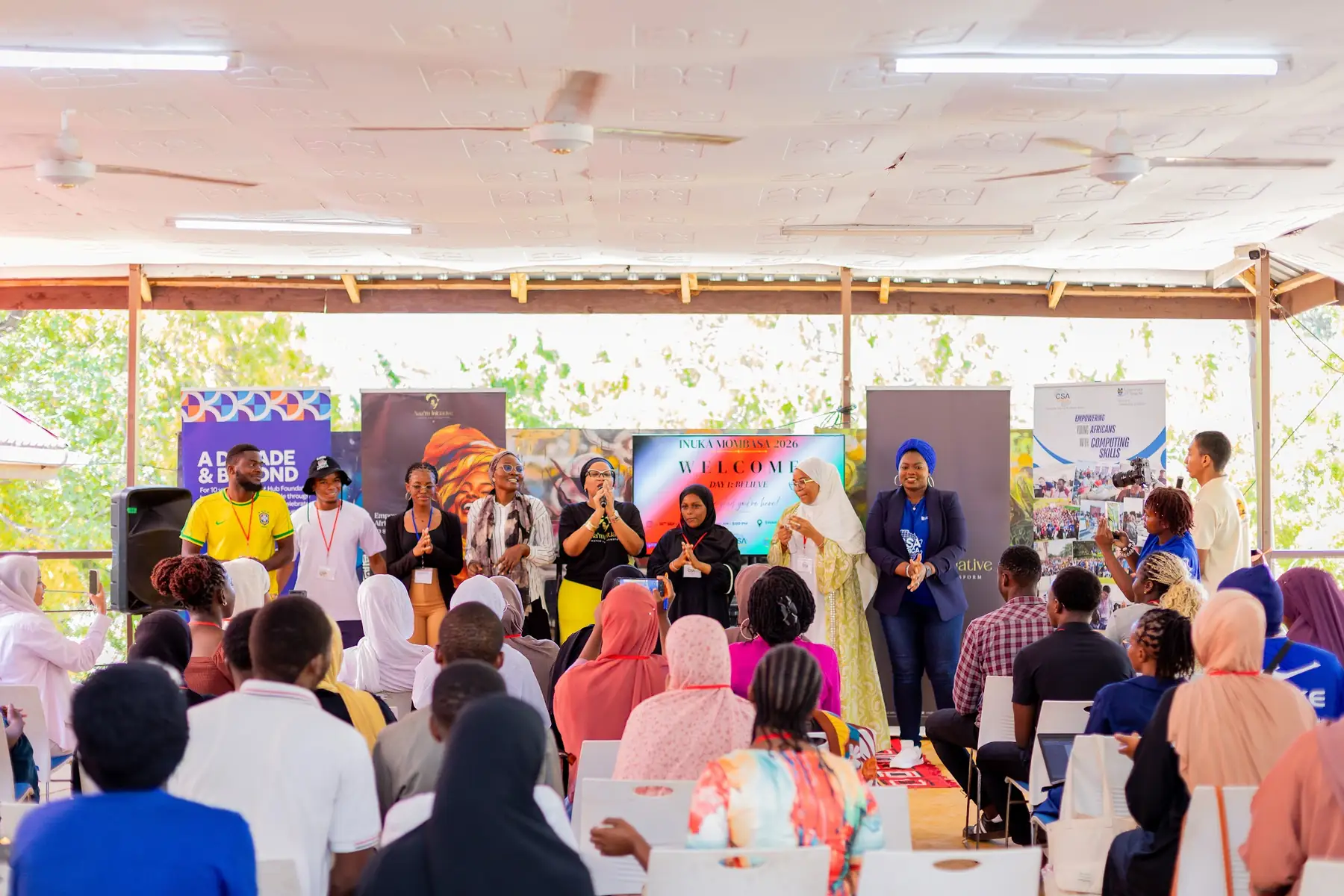 Facilitators standing at the front of a session